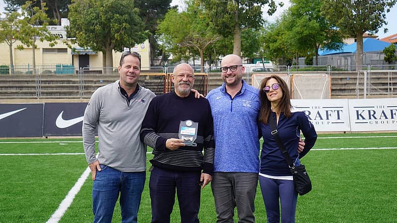 Burdman (center, left) is presented the Man of the Year award by Israel Lacrosse Executive Director Scott Neiss (center, right), Board Member Daniel Kraft (left) and Wendy Kraft (right).